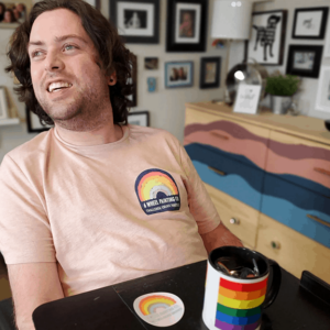 Queer man using wheelchair