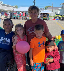 Loyola, Suzanne and their family at the farmer's market.