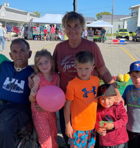 Loyola, Suzanne and their family at the farmer's market.