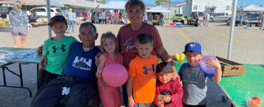 Loyola, Suzanne and their family at the farmer's market.