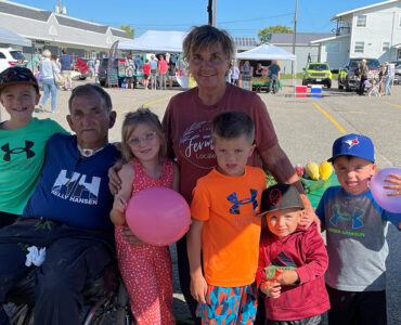 Loyola, Suzanne and their family at the farmer's market.