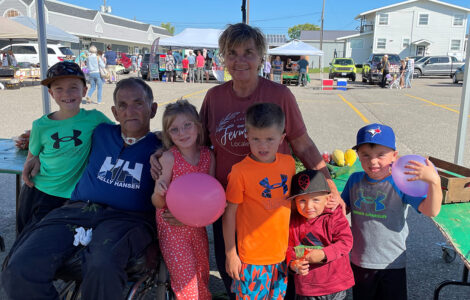 Loyola, Suzanne and their family at the farmer's market.