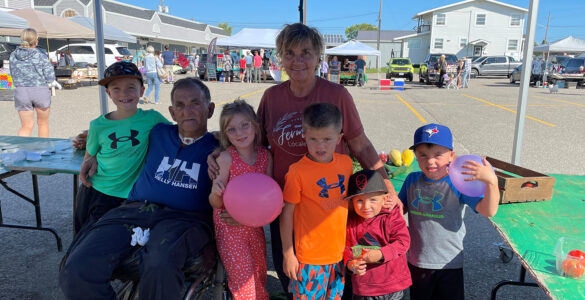 Loyola, Suzanne and their family at the farmer's market.