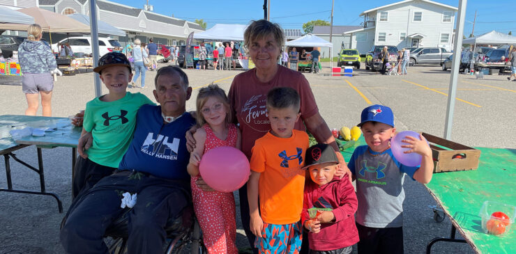 Loyola, Suzanne and their family at the farmer's market.