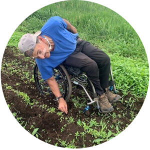 Loyola tending to his crops on the farm.