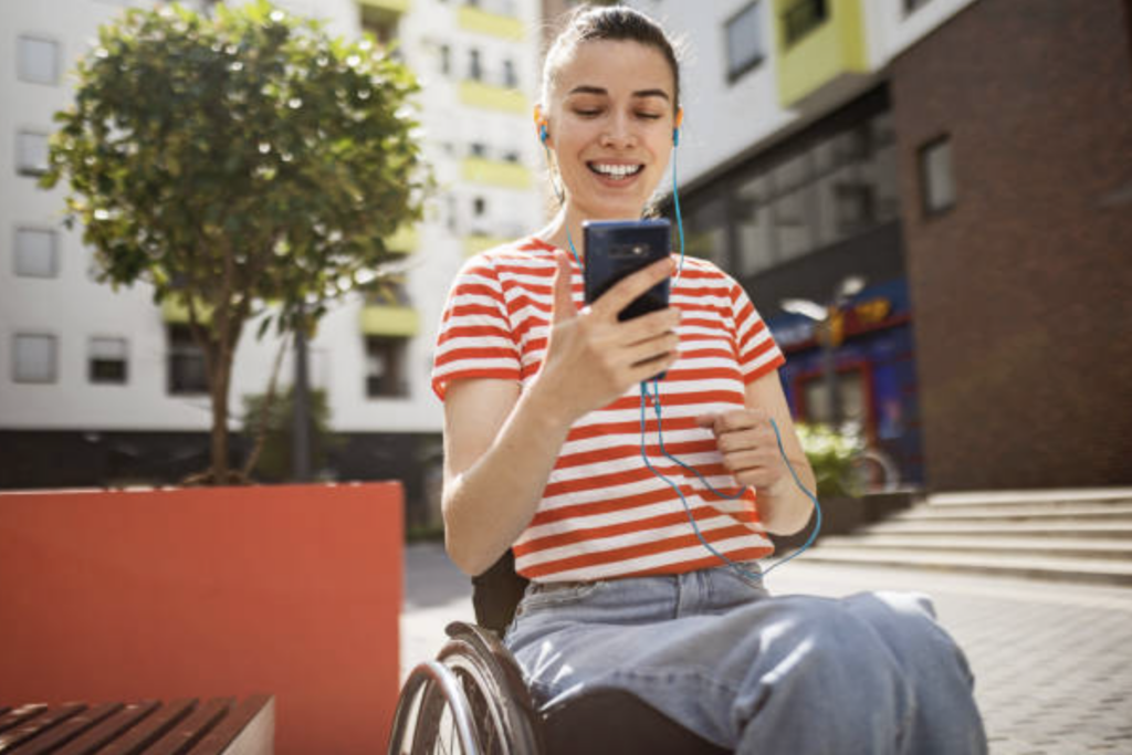 Lady with phone in wheelchair