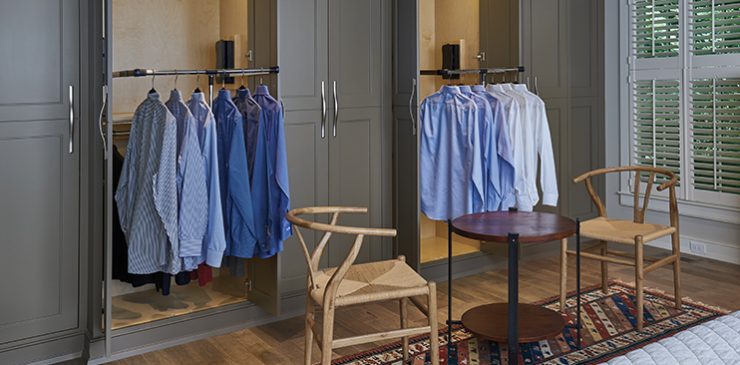 A closet showing pull-down shirt rods.