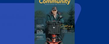 Magazine cover of SCIO community member riding his scooter.