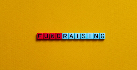 Letter beads that spell the word FUNDRAISING