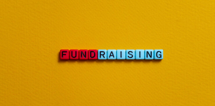 Letter beads that spell the word FUNDRAISING