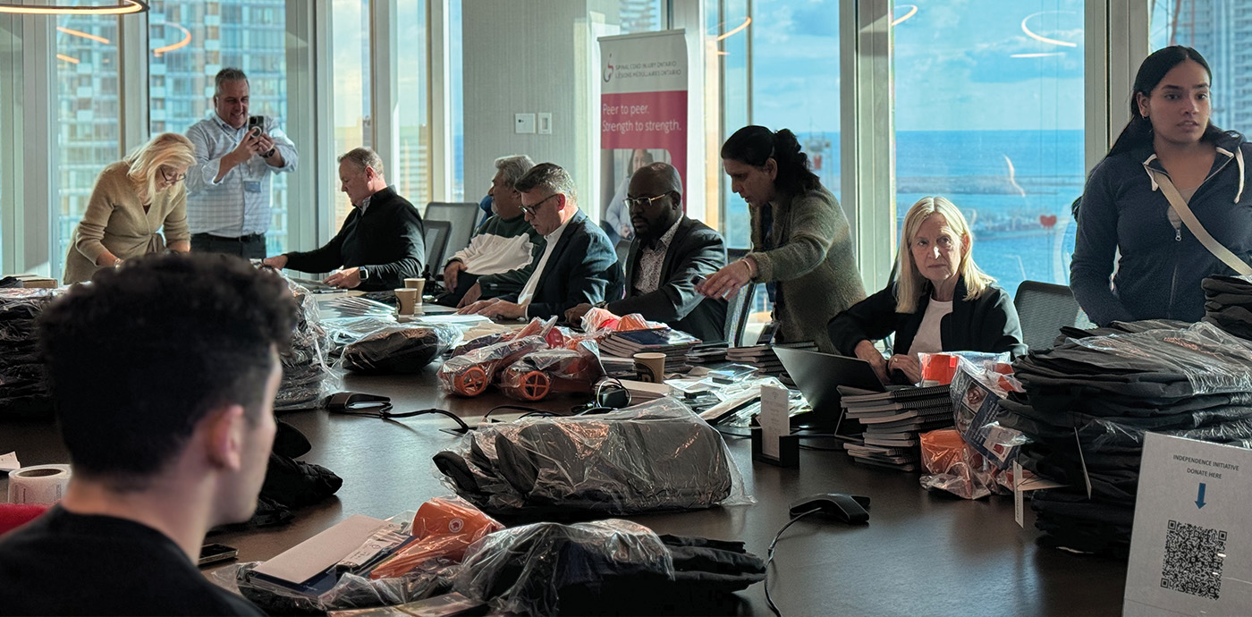 SCIO and McLeish Orlando employees join forces to stuff essentials into bags for people who have incurred an SCI.