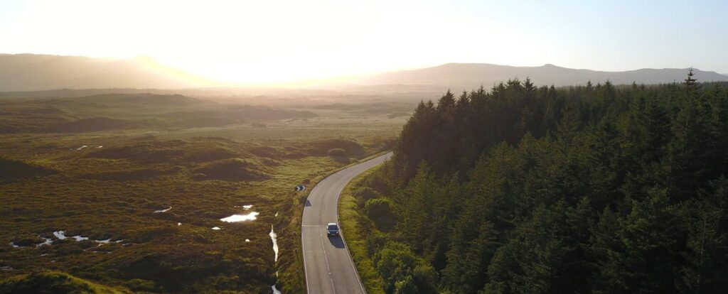 cars driving along winding road