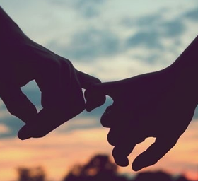 hands holding pinky fingers